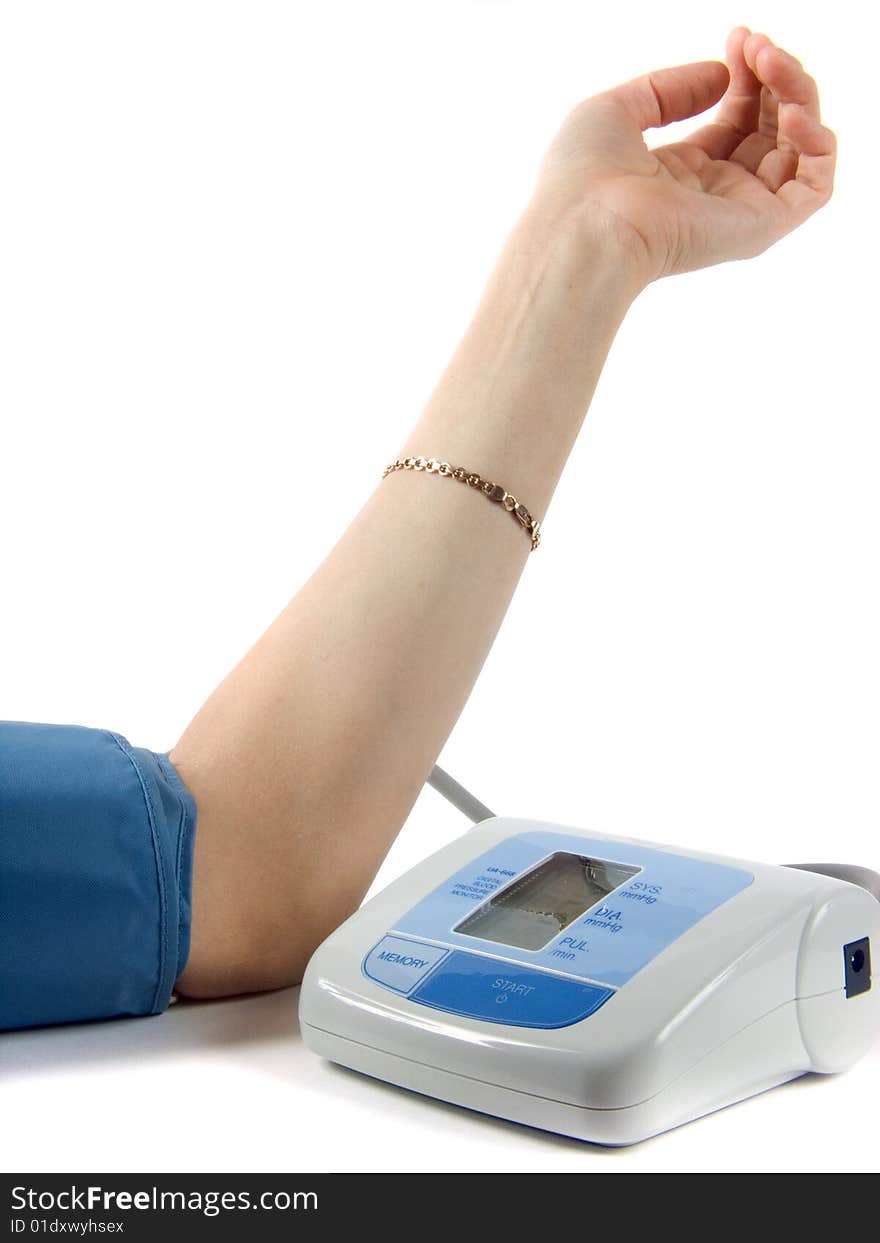 Feminine hand with instrument measuring pressure and pulse. Feminine hand with instrument measuring pressure and pulse