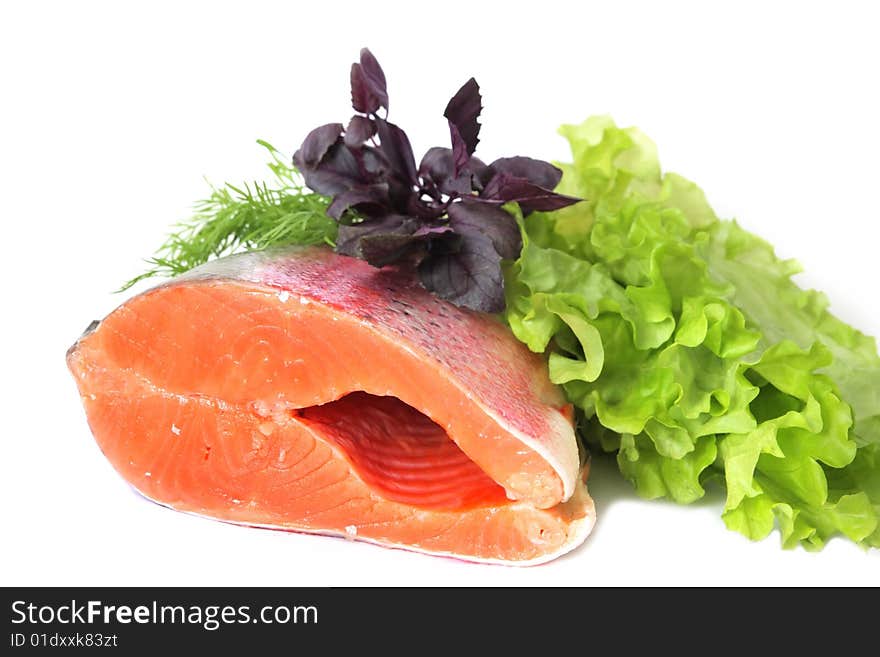 Red fish with greens on a white background