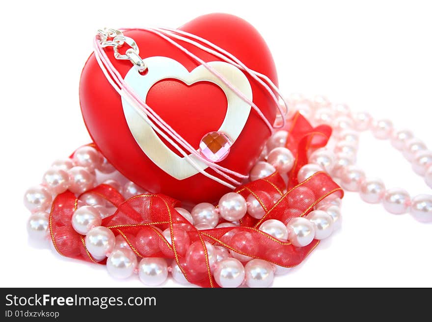 Valentine hearts,red ribbon,pink pearls on white background.