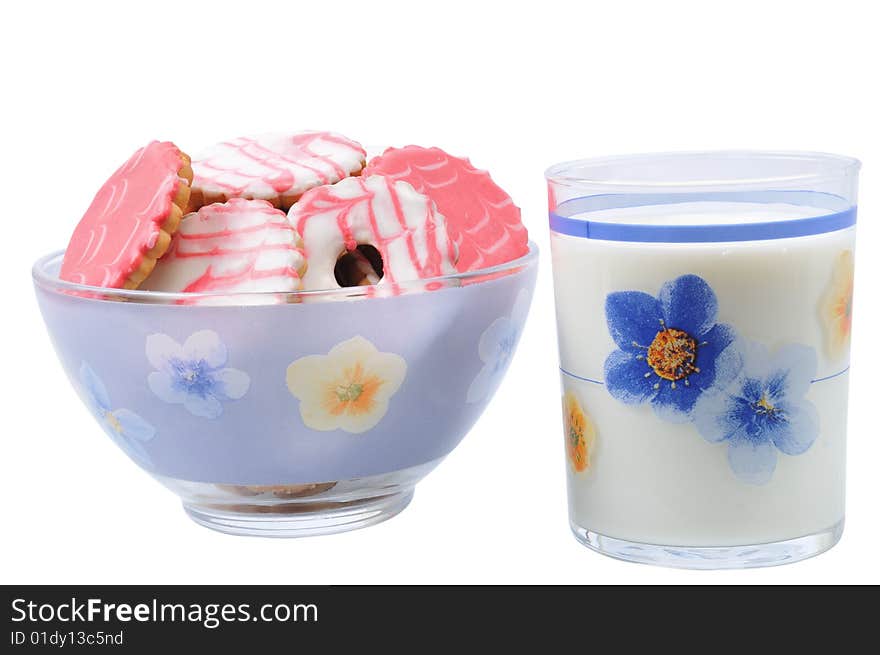 Tasty cake in dish near glass with milk on isolated background