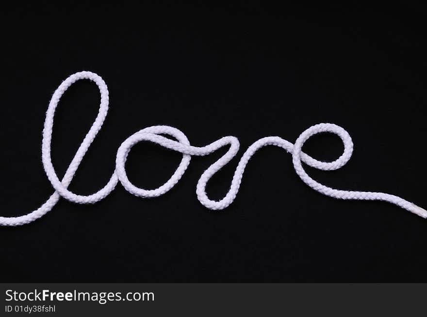 I love you by the rope over black background