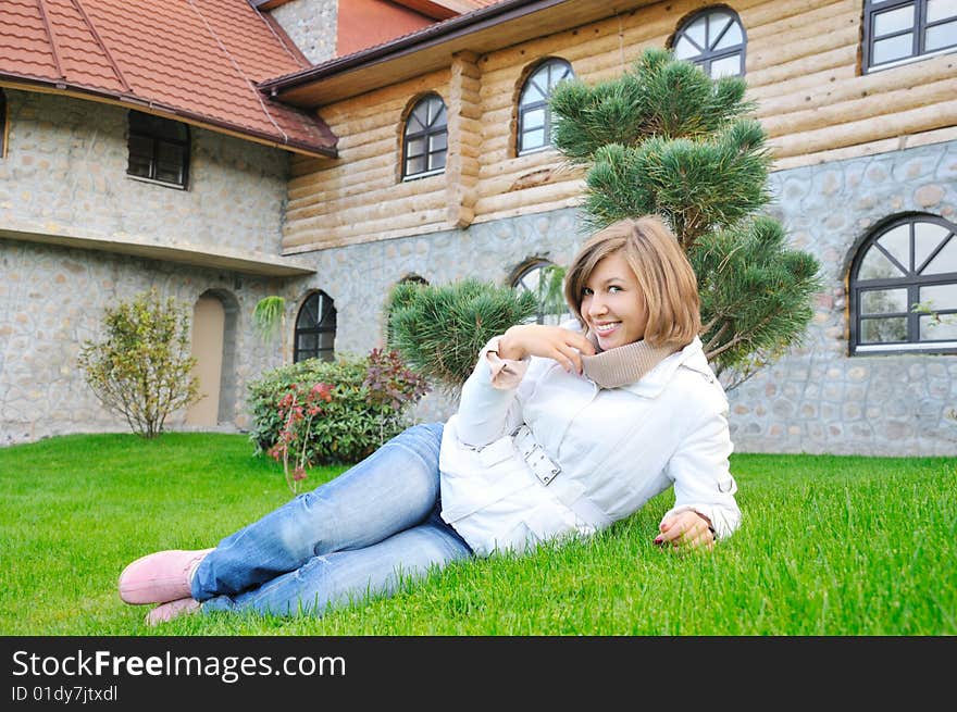 Nice smiling girl lie on grass. Nice smiling girl lie on grass