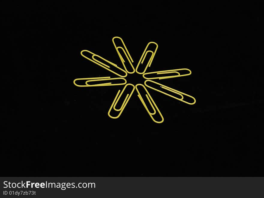 Paperclips sun on black background. Paperclips sun on black background