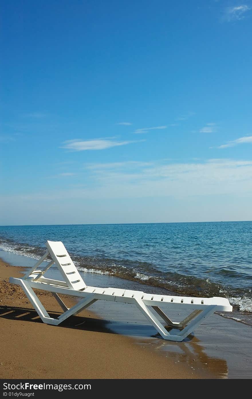 Single white bed on shore sea. Single white bed on shore sea