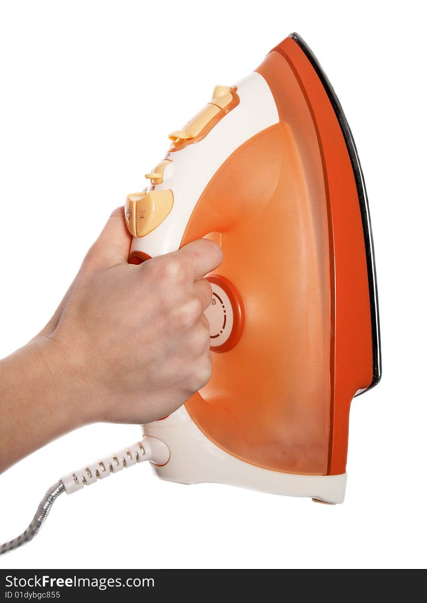 The hand holds an iron on a white background