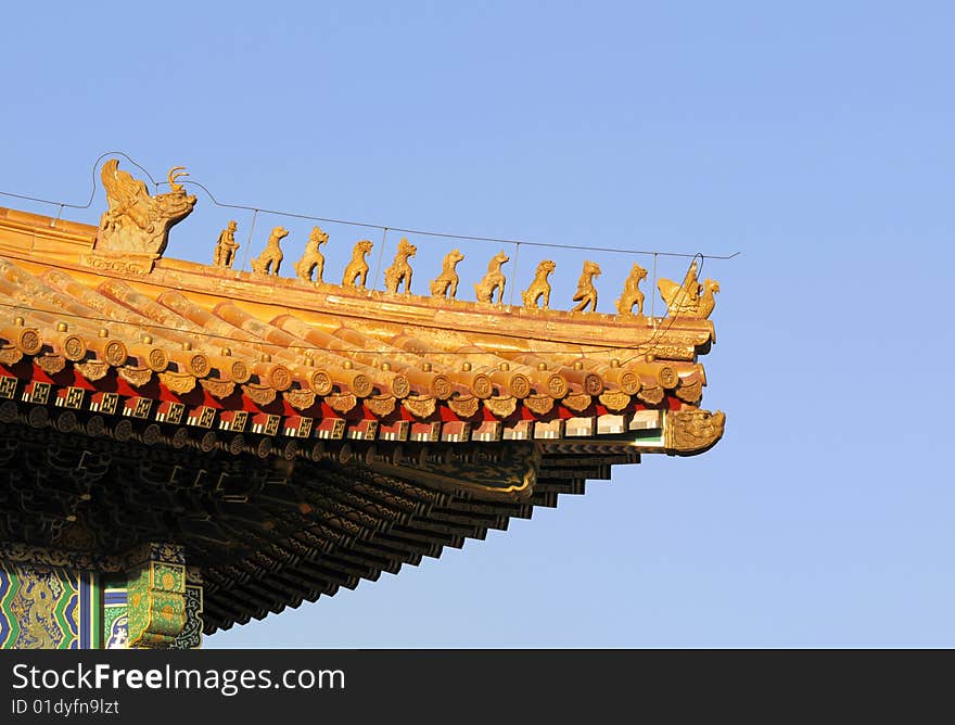 Royal Golden Roof and Holy Animal Ornament on The Imperial Palace (Gu-gong is Chinese Name as well-known). Royal Golden Roof and Holy Animal Ornament on The Imperial Palace (Gu-gong is Chinese Name as well-known)