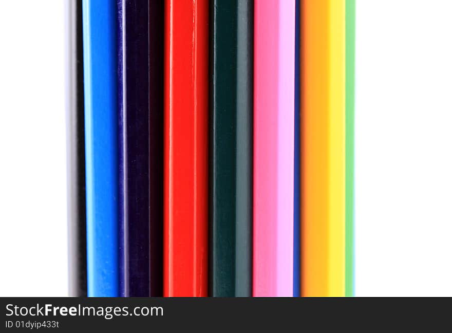 Many coloured pencils together in a vertical view. Many coloured pencils together in a vertical view