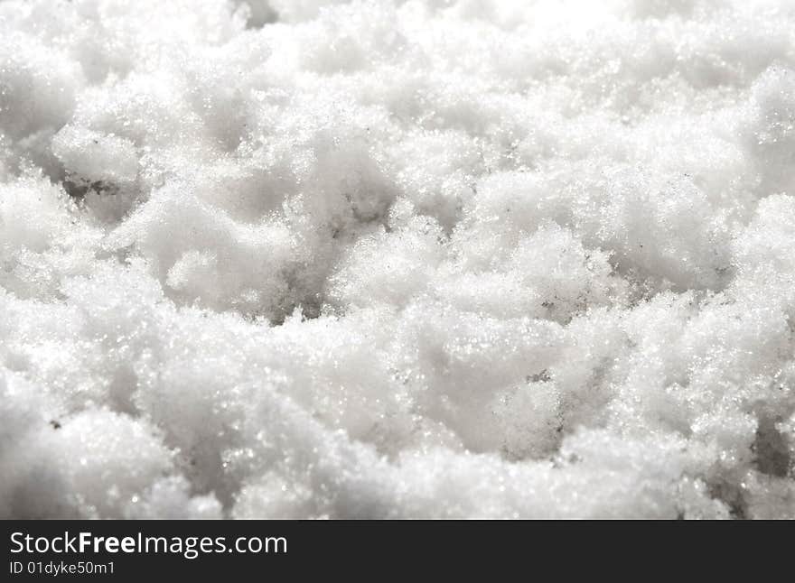 Background of white snow. close up