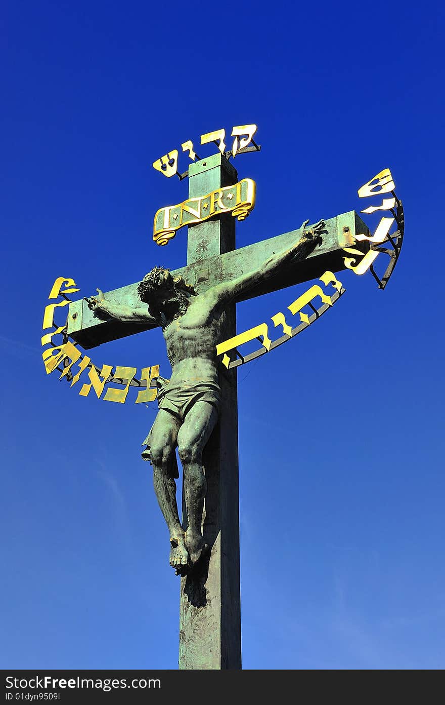 Prague Charles Bridge crucifixion Jesus blue sky