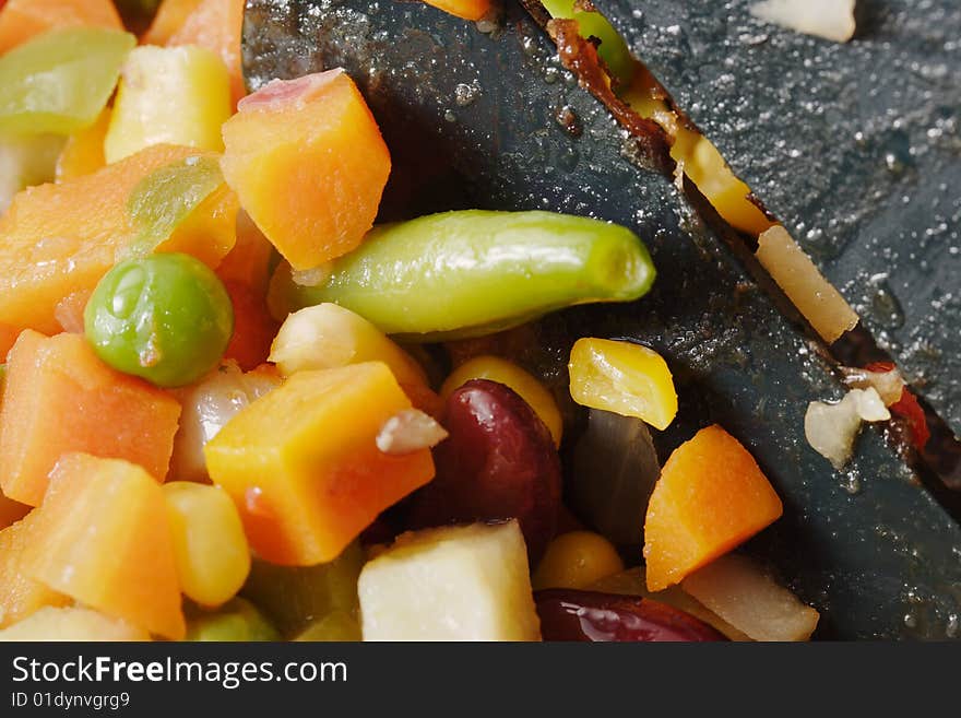 Fried vegetables on the skillet. Hot and fresh. Narrow depth of field. Fried vegetables on the skillet. Hot and fresh. Narrow depth of field.