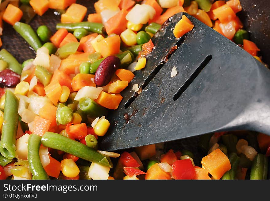 Fried vegetables on the skillet. Hot and fresh. Narrow depth of field. Fried vegetables on the skillet. Hot and fresh. Narrow depth of field.