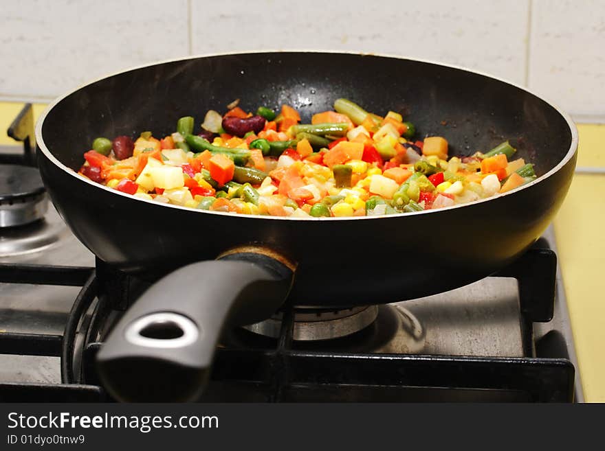 Fried vegetables on the skillet. Hot and fresh. Narrow depth of field. Fried vegetables on the skillet. Hot and fresh. Narrow depth of field.