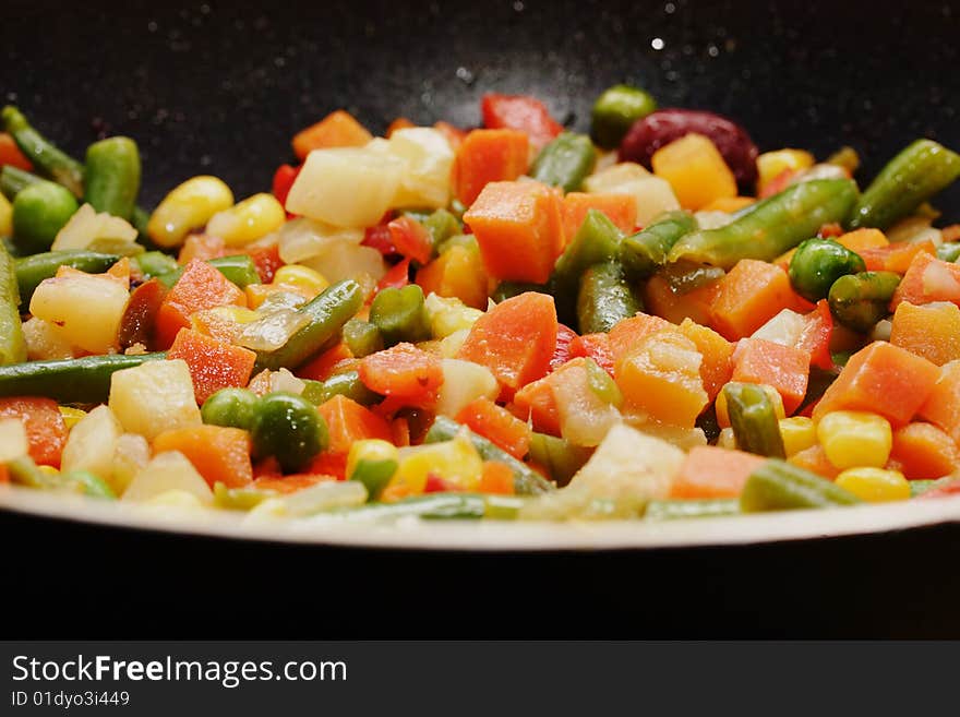 Fried vegetables on the skillet. Hot and fresh. Narrow depth of field. Fried vegetables on the skillet. Hot and fresh. Narrow depth of field.