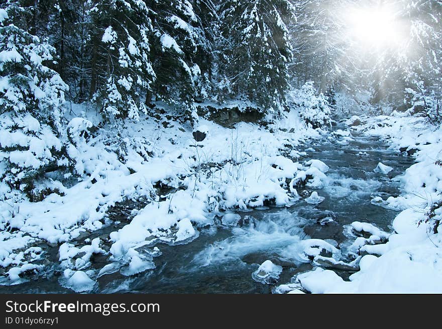 Winter landscape with bright sun