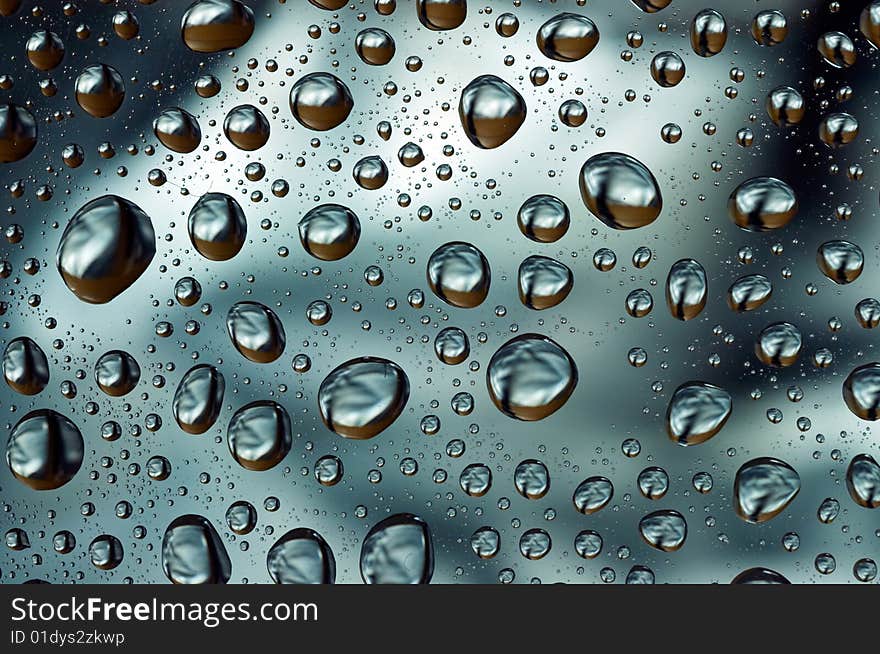 Water droplets on glass background