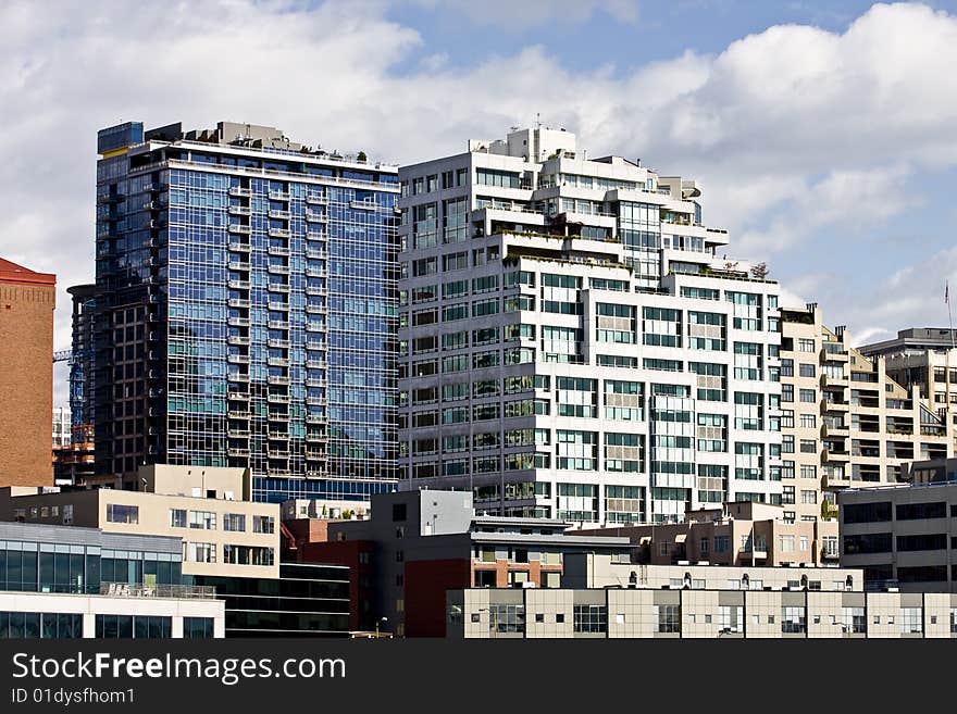 Modern blue and white buildings in a city skyline. Modern blue and white buildings in a city skyline