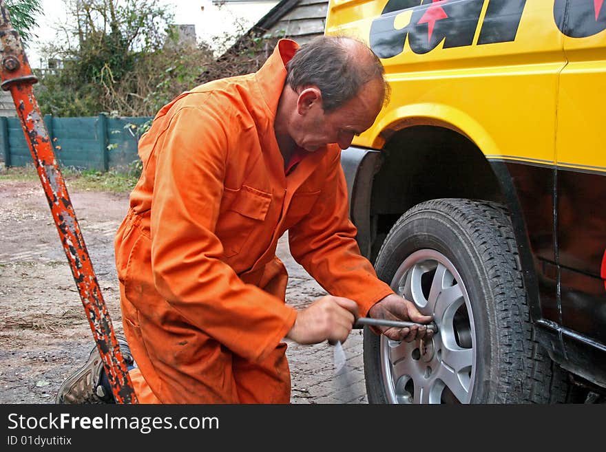 Mechanic Changing Wheel