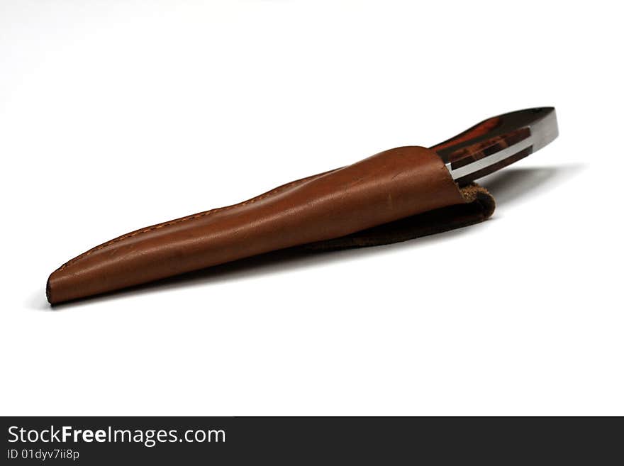 Hunting knife in the leather scabbard isolated on a white background