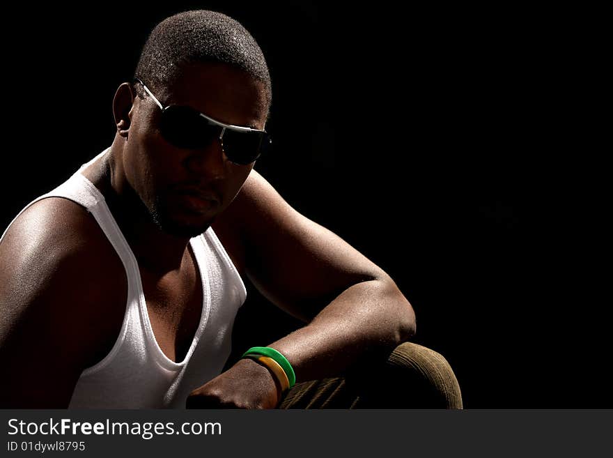 Young african american male on black background