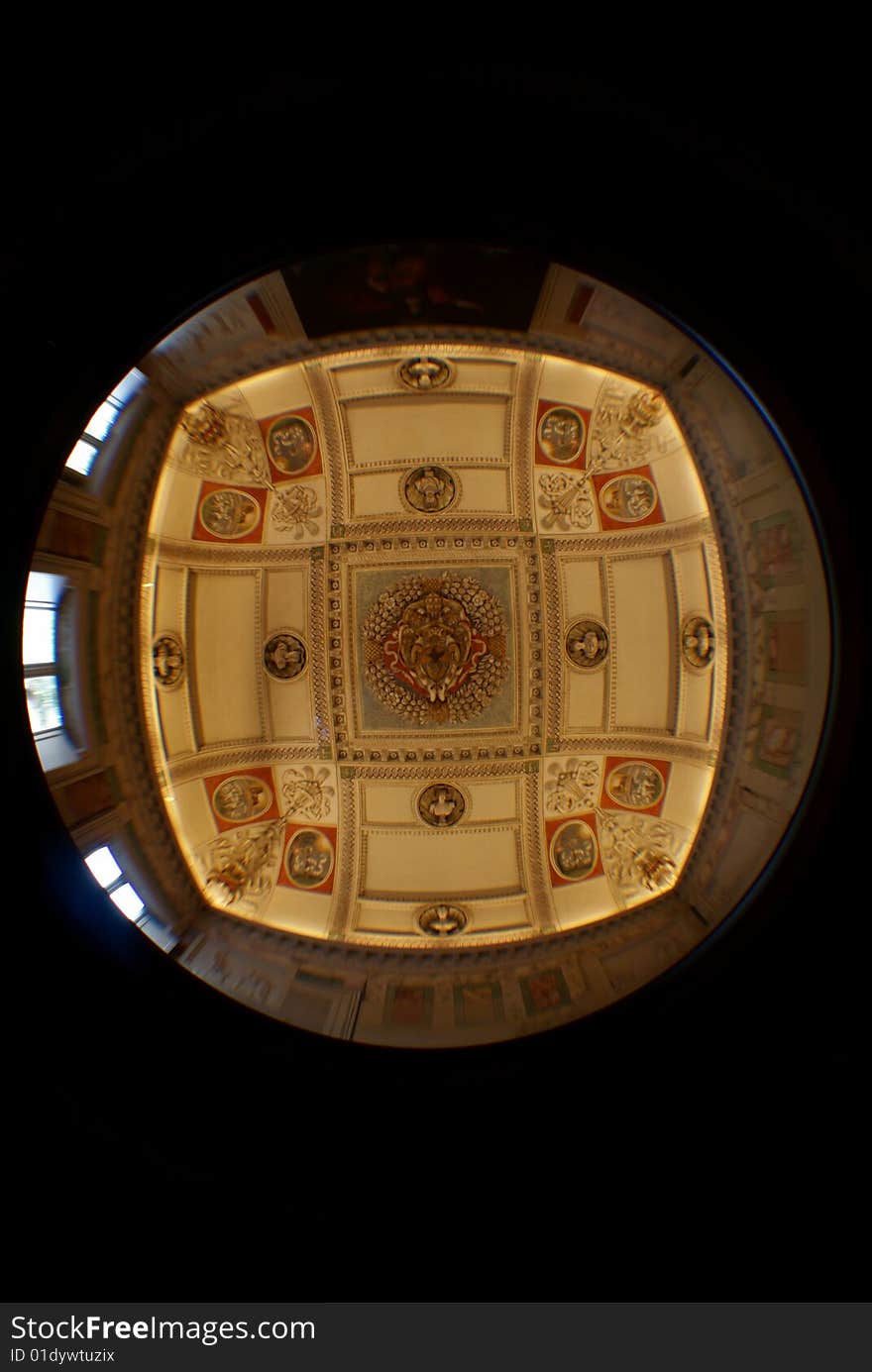 Interior roof in an audience hall in VIlla Lante in Rome, formed into a cross with fisheye. Older Papal insignia in the middle with busts from greek mythology on the sides. Interior roof in an audience hall in VIlla Lante in Rome, formed into a cross with fisheye. Older Papal insignia in the middle with busts from greek mythology on the sides