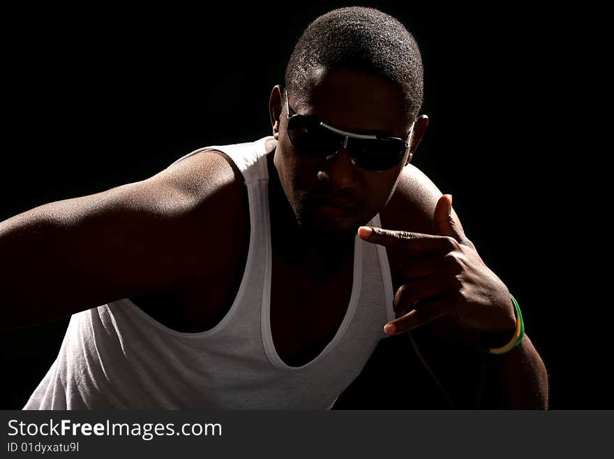 Young african american male on black background