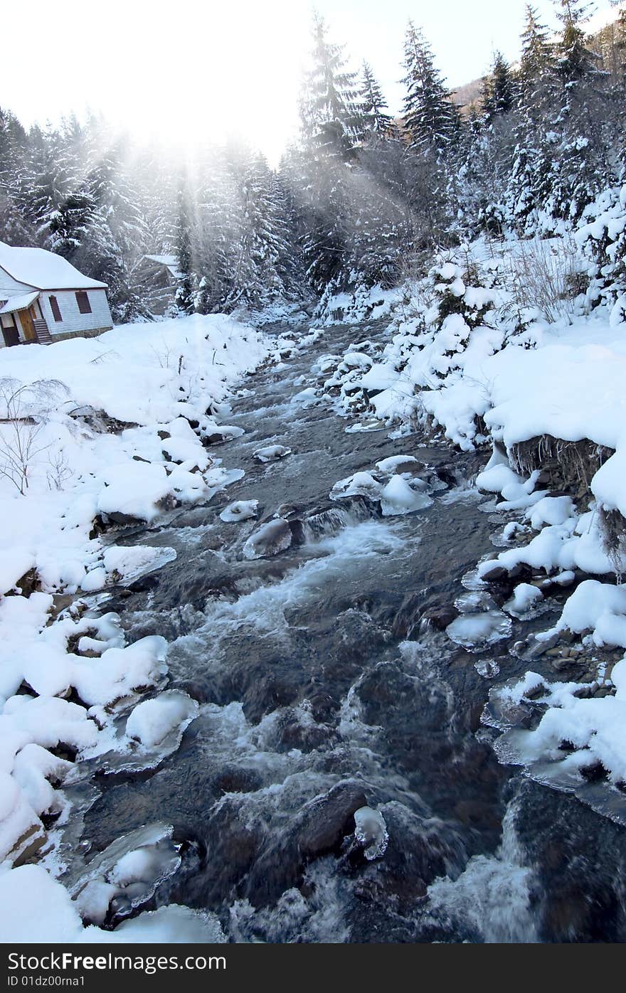 Winter landscape with bright sun