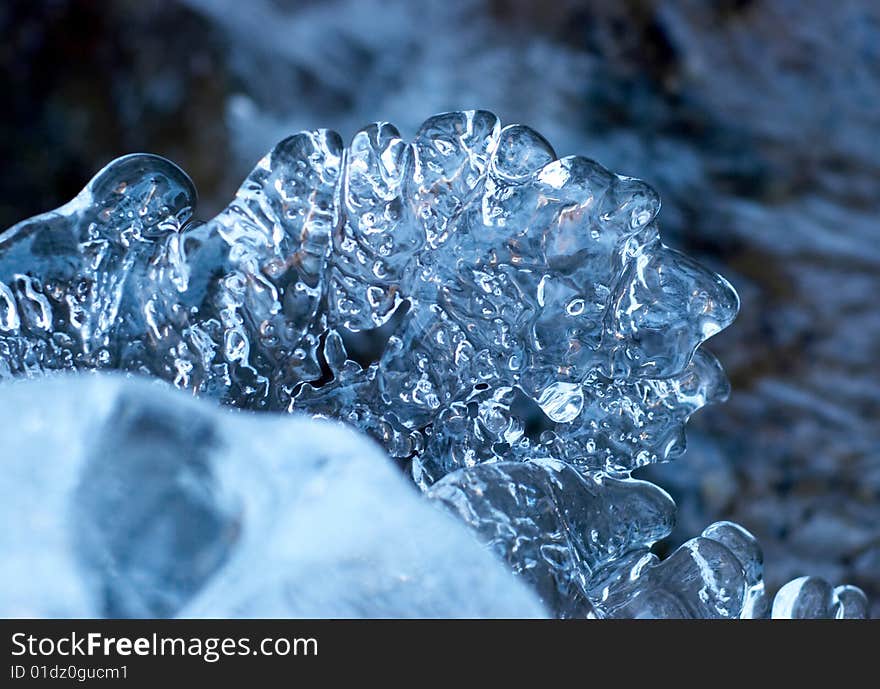 Ice figure on flowing river background. Ice figure on flowing river background