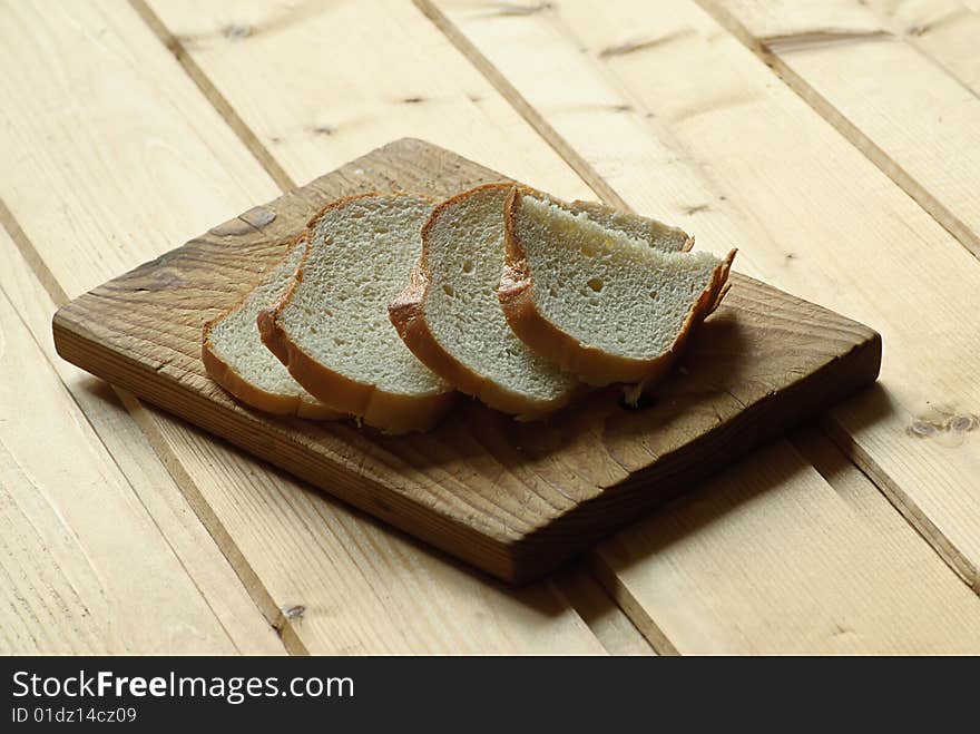 Bread on wooden plate