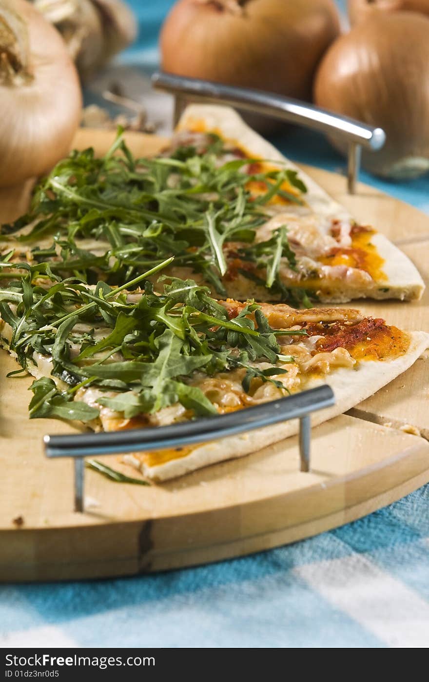 Oven baked pizza served on wooden board