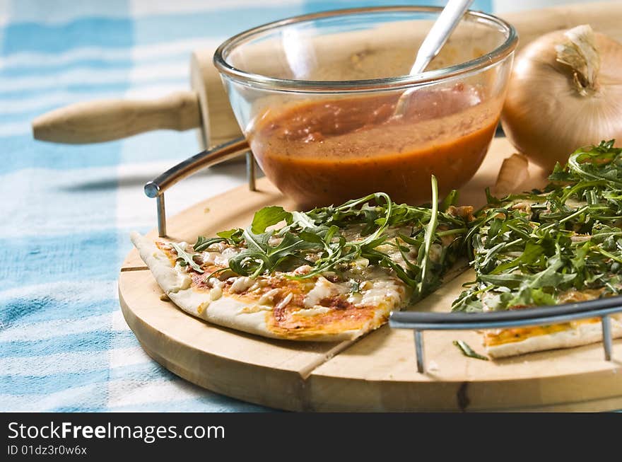 Oven baked pizza served on wooden board