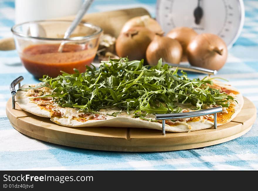 Oven baked pizza served on wooden board