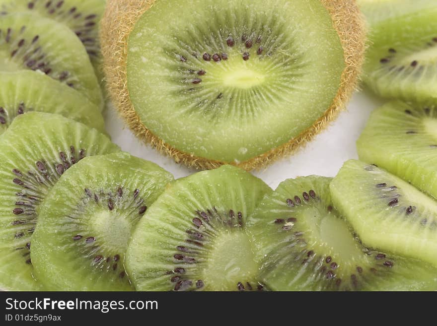 Kiwi fruit slices on saucer