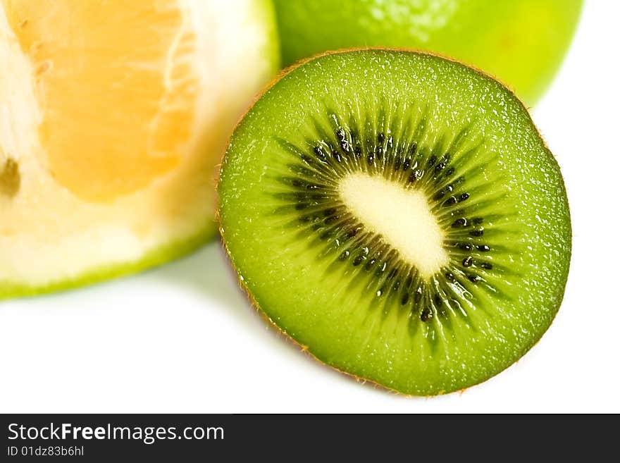 Juicy and fresh Kiwi fruit, macro,closeup inside and grapefruit in the back, isolated on white background. Juicy and fresh Kiwi fruit, macro,closeup inside and grapefruit in the back, isolated on white background