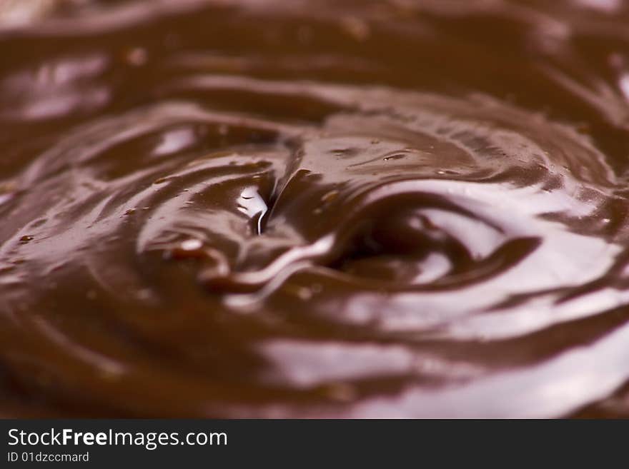 Macro of liquid chocolate making irresistible waves. Macro of liquid chocolate making irresistible waves.