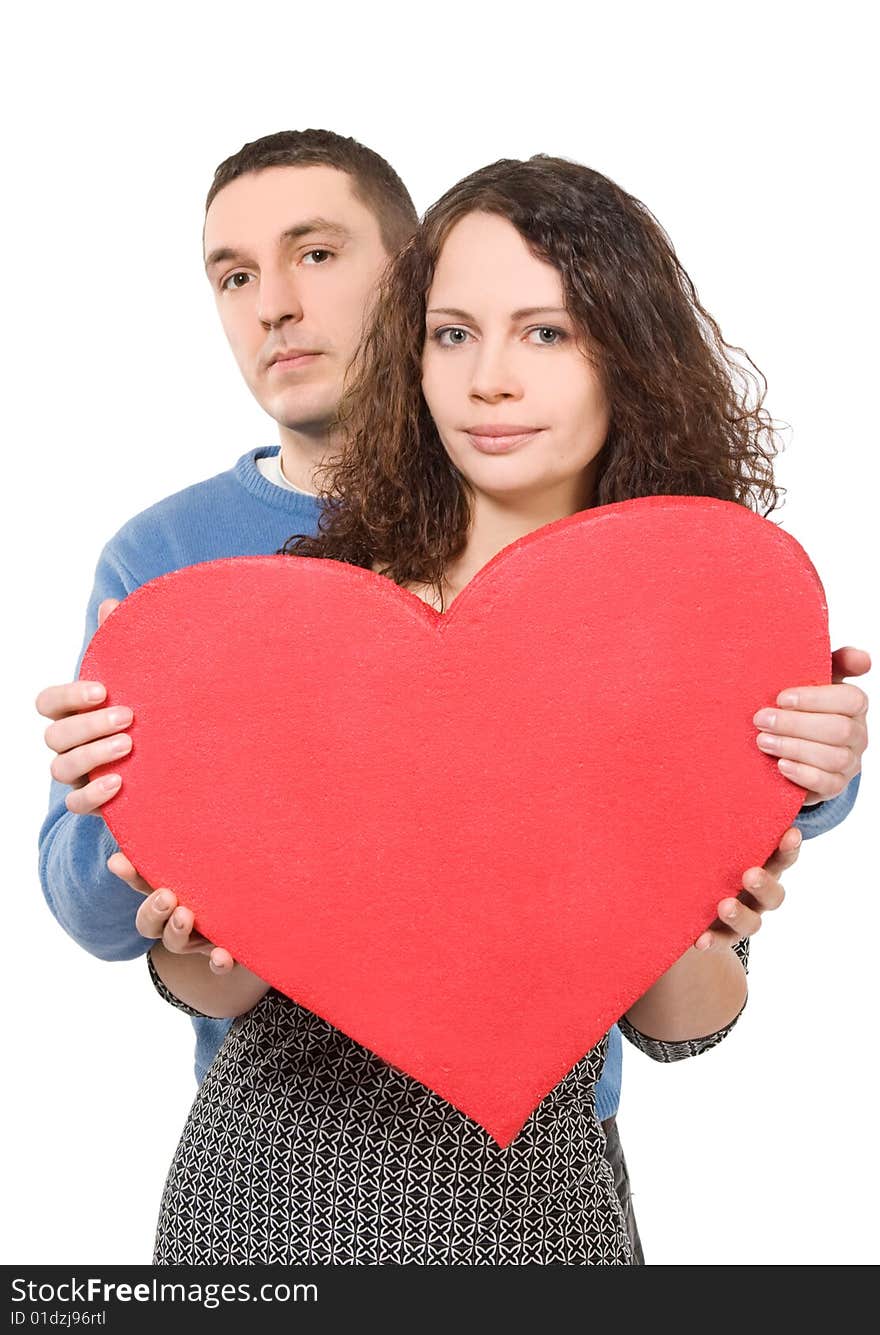 Loving couple holding big heart