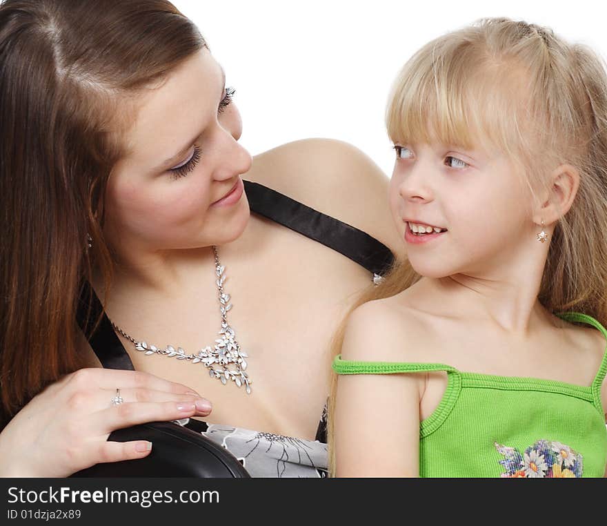 The young woman and  girl are isolated on a white background