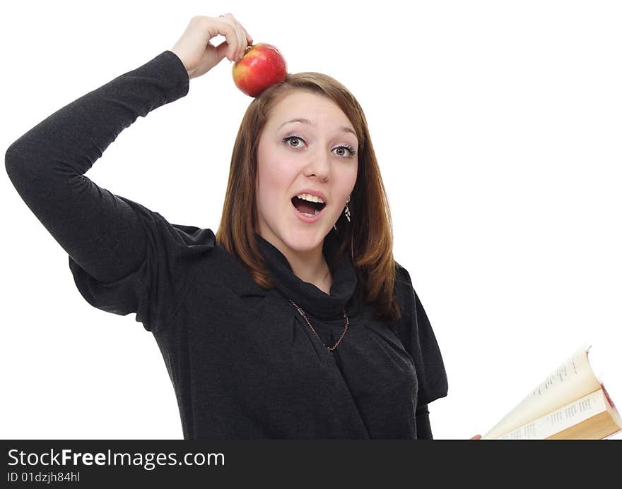 The girl with the book and a red apple on a white background. The girl with the book and a red apple on a white background