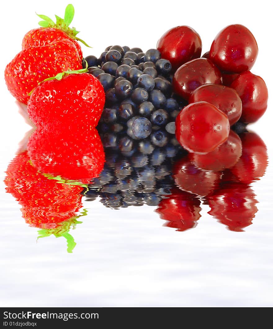 Fresh strawberries, bilberries and sweet cherry close up. Fresh strawberries, bilberries and sweet cherry close up