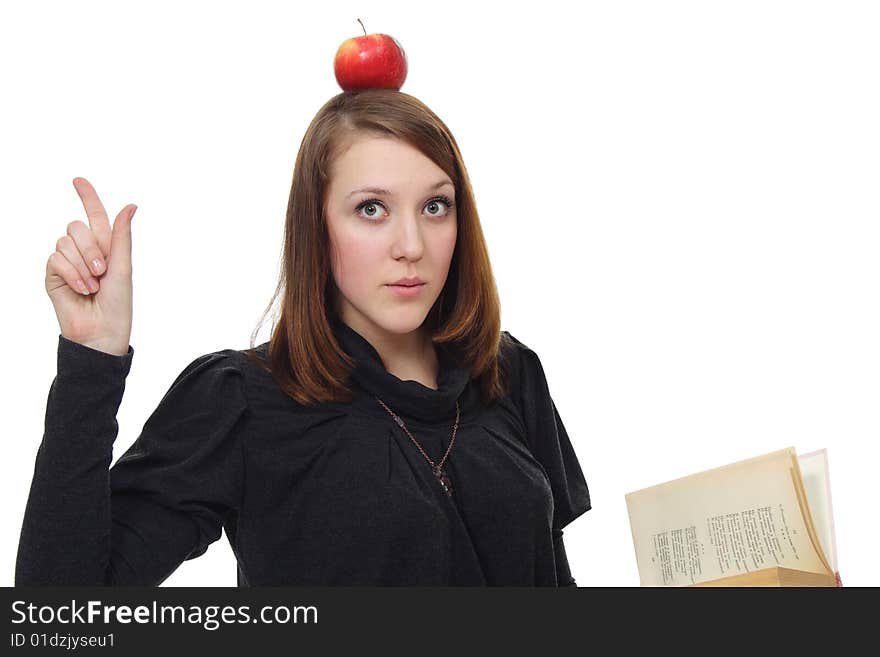 The girl with the book and a red apple on a white background. The girl with the book and a red apple on a white background