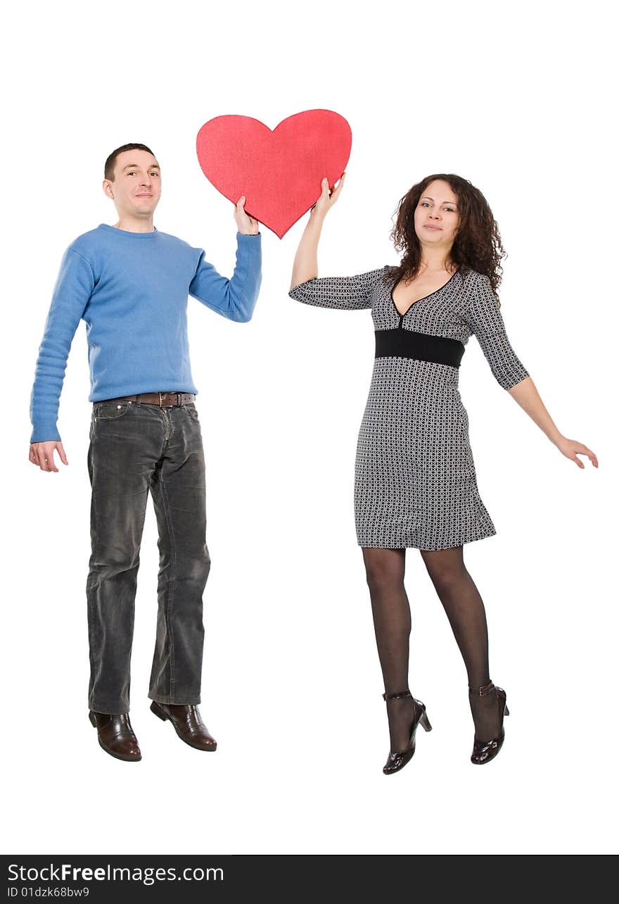 Happy jumping couple with heart isolated over white