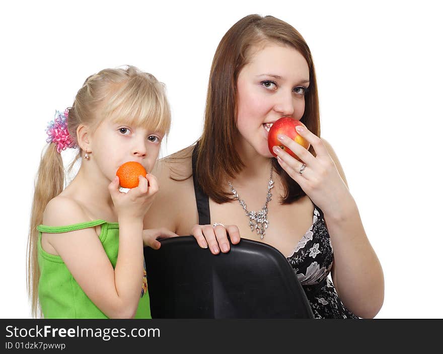 The child and girl with fruit