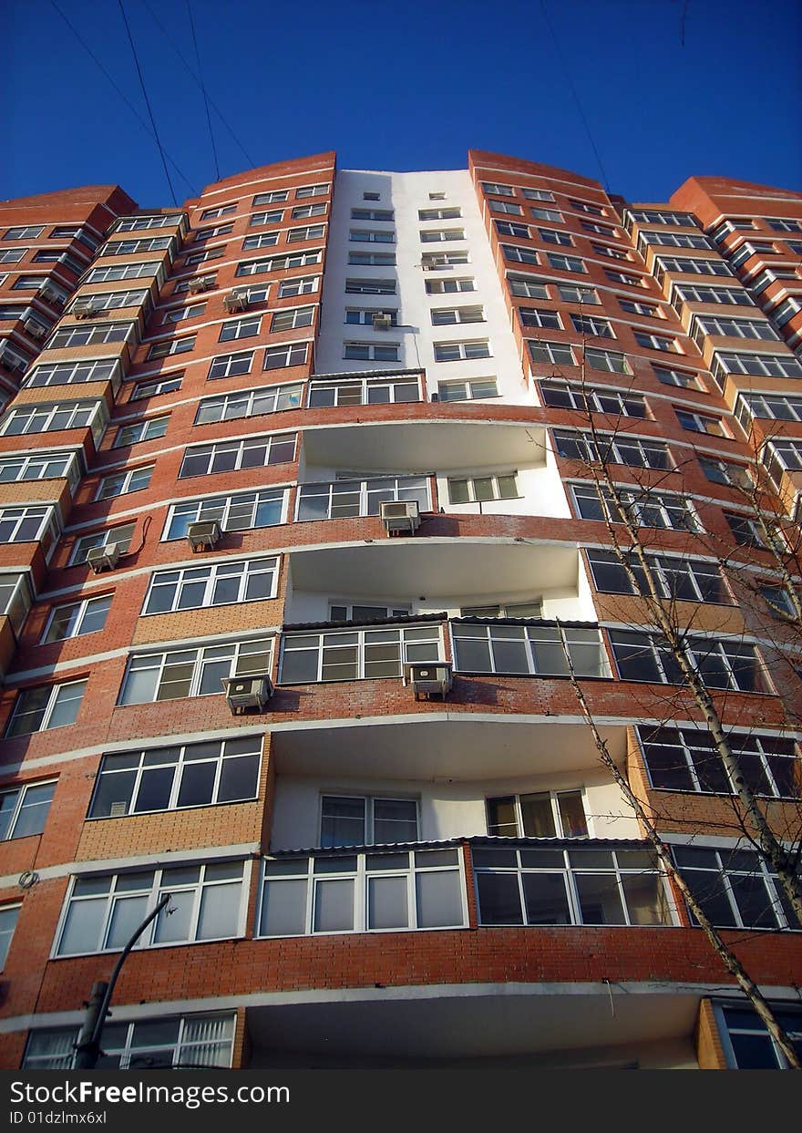 Front of modern house and clear blue sky. Front of modern house and clear blue sky.