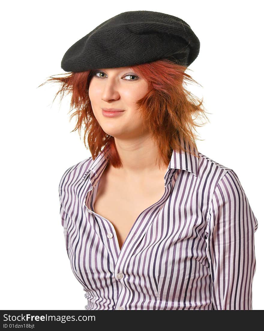 A young woman with disordered hair in a black hat