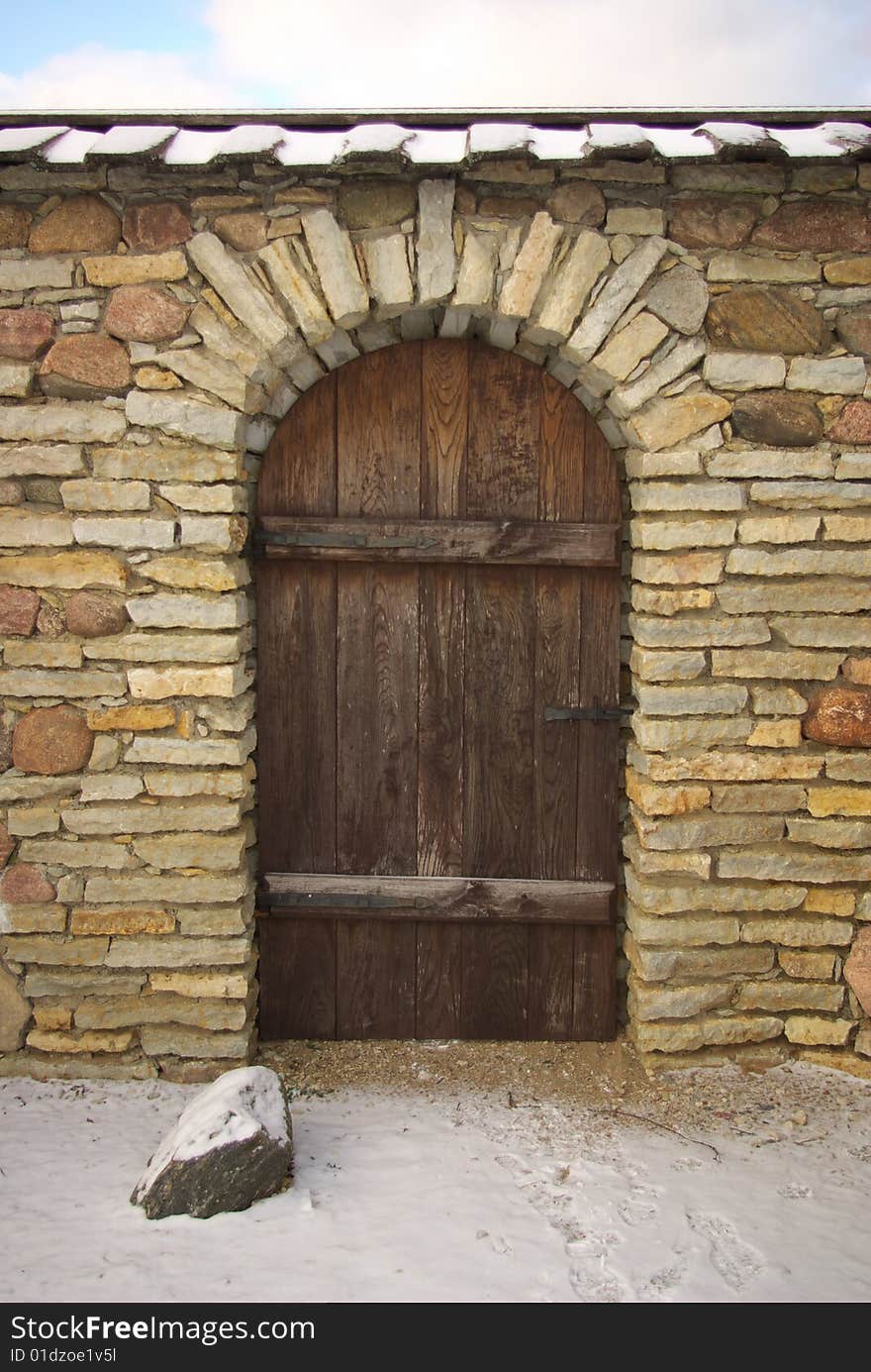 Wooden Door In Stone Wall