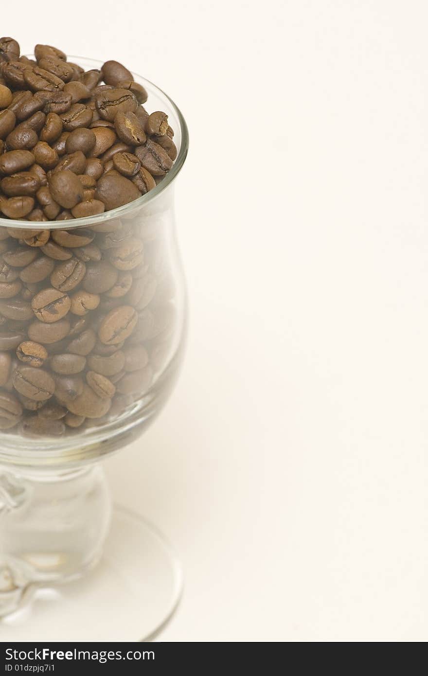 Half glass of coffee on white background. Half glass of coffee on white background