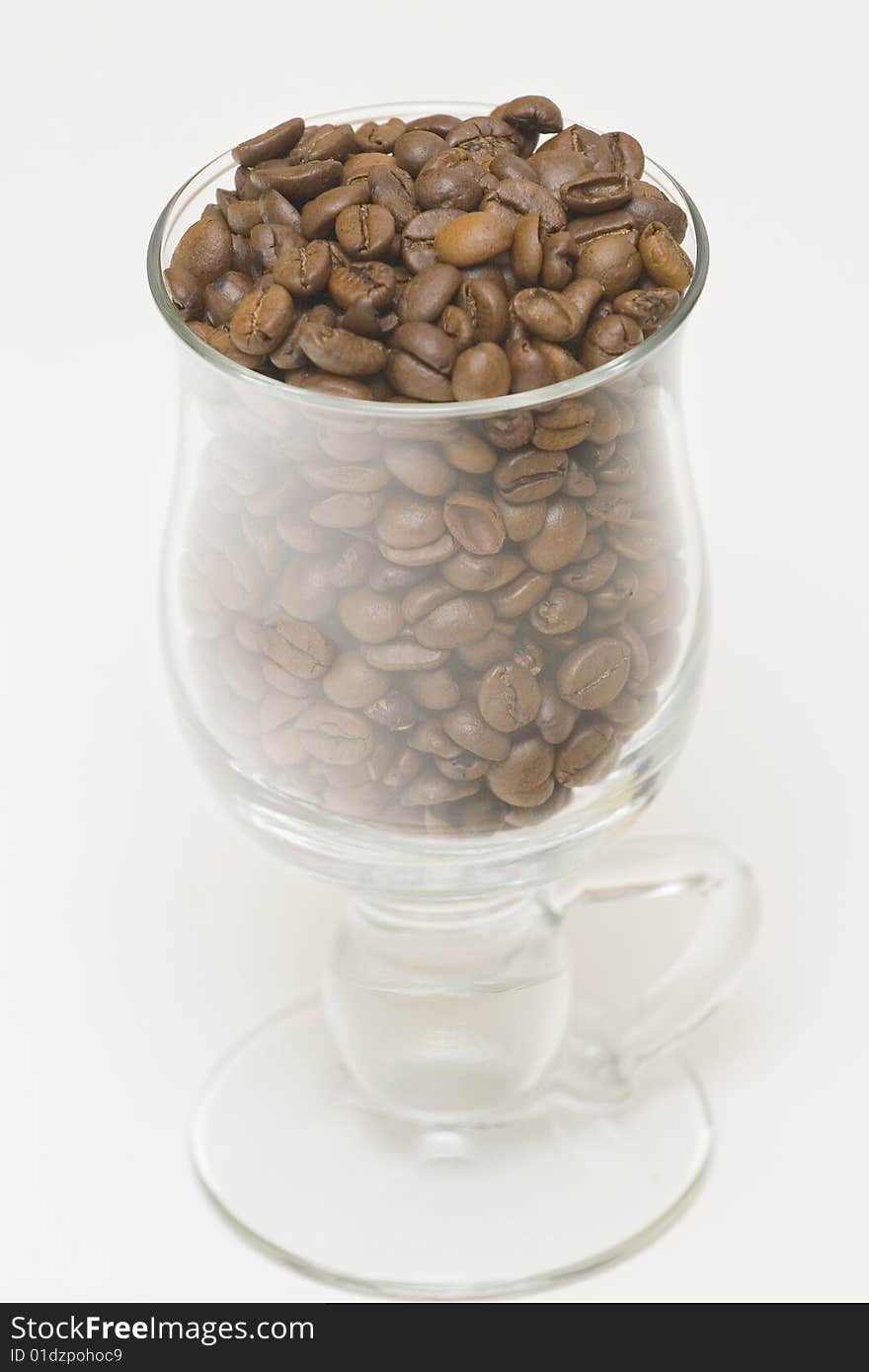 Seeds of coffee in high glass. Seeds of coffee in high glass