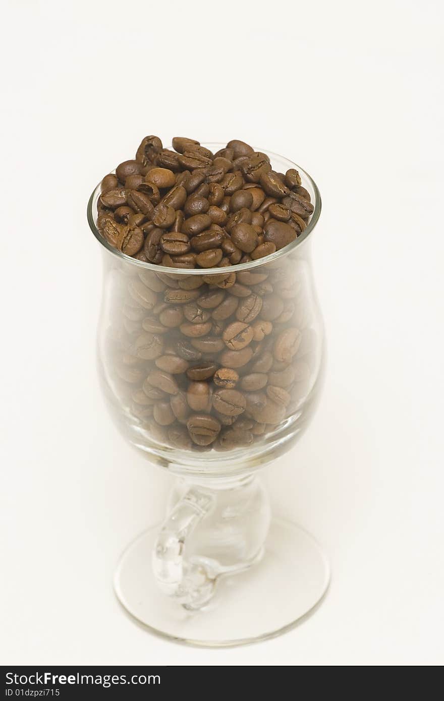 Seeds of coffee in high glass. Seeds of coffee in high glass