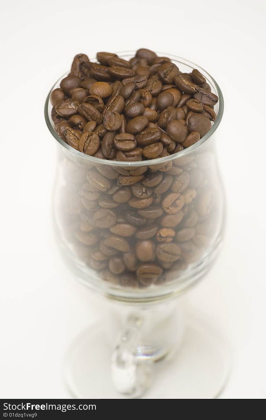 Seeds of coffee in high glass. Seeds of coffee in high glass