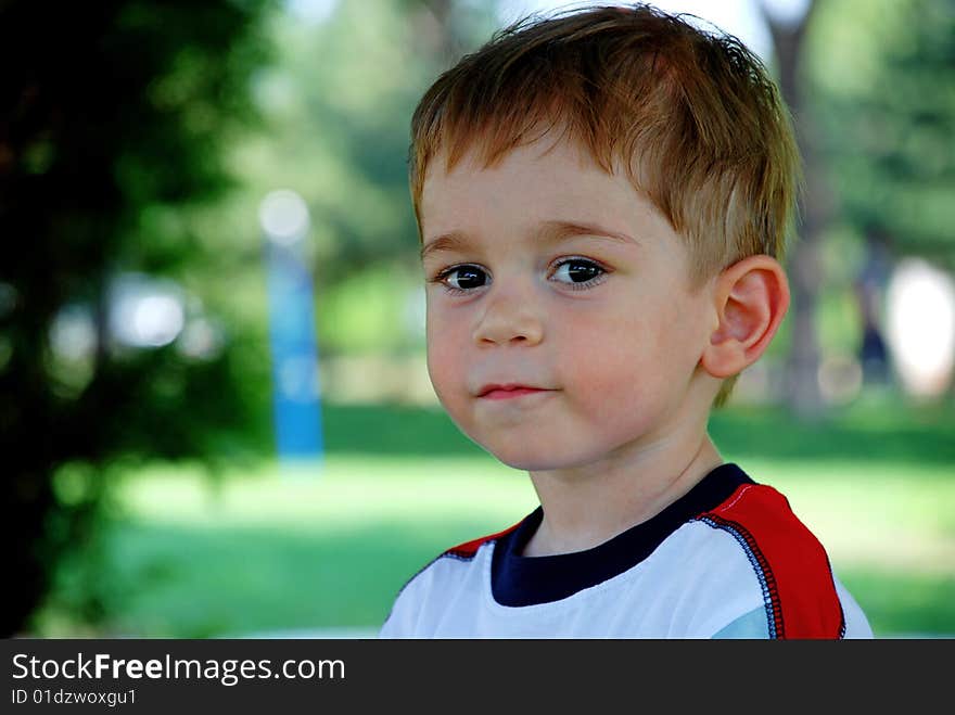 Photo of little boy looking at camera