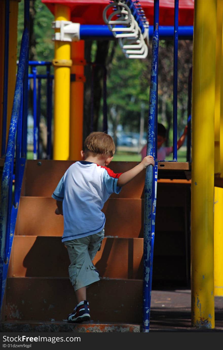 Little boy playing in playground. Little boy playing in playground